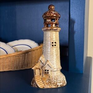 Glazed lighthouse candle holder.